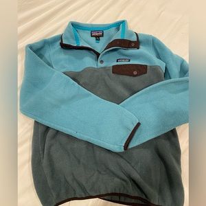 Patagonia size M synchilla. Fleece material but will keep you so warm!